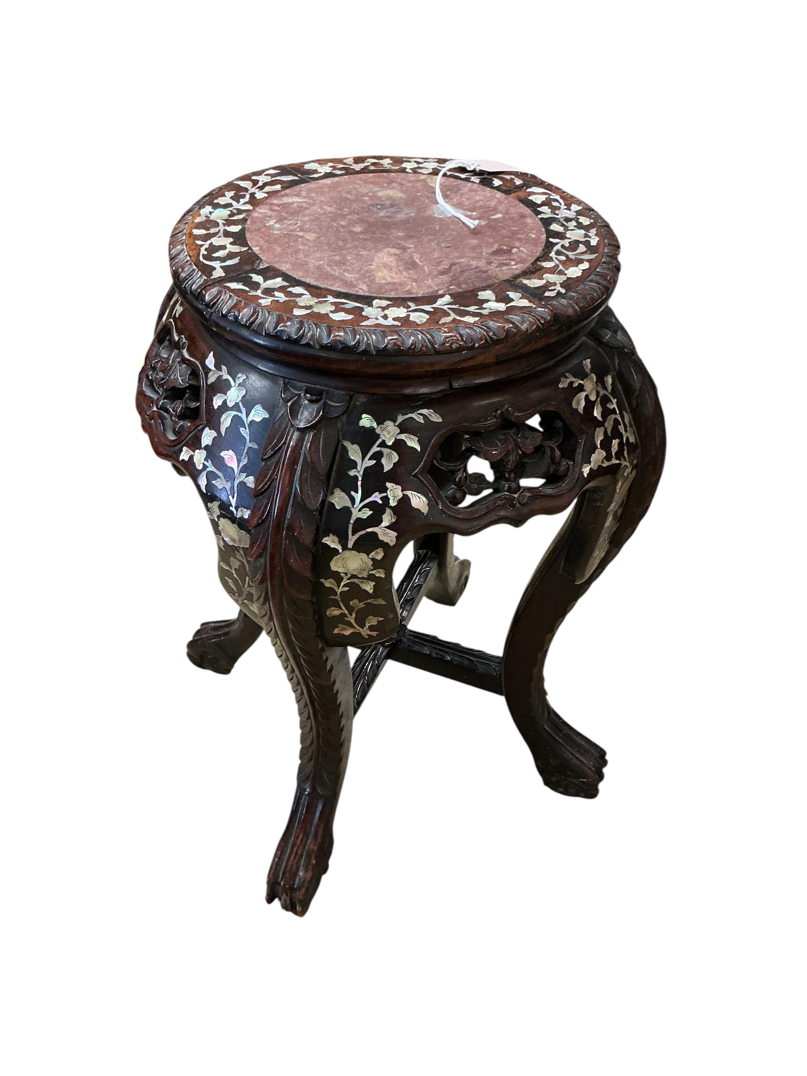 A Chinese mother of pearl inlaid rouge marble topped carved hardwood jardiniere stand, height 60cm